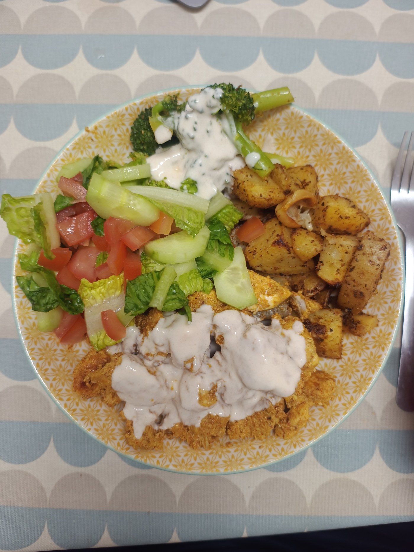 Chicken with garlic herb potatoes and yoghurt sauce